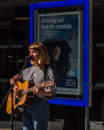 Photo of busker in Glasgow by Norman Young